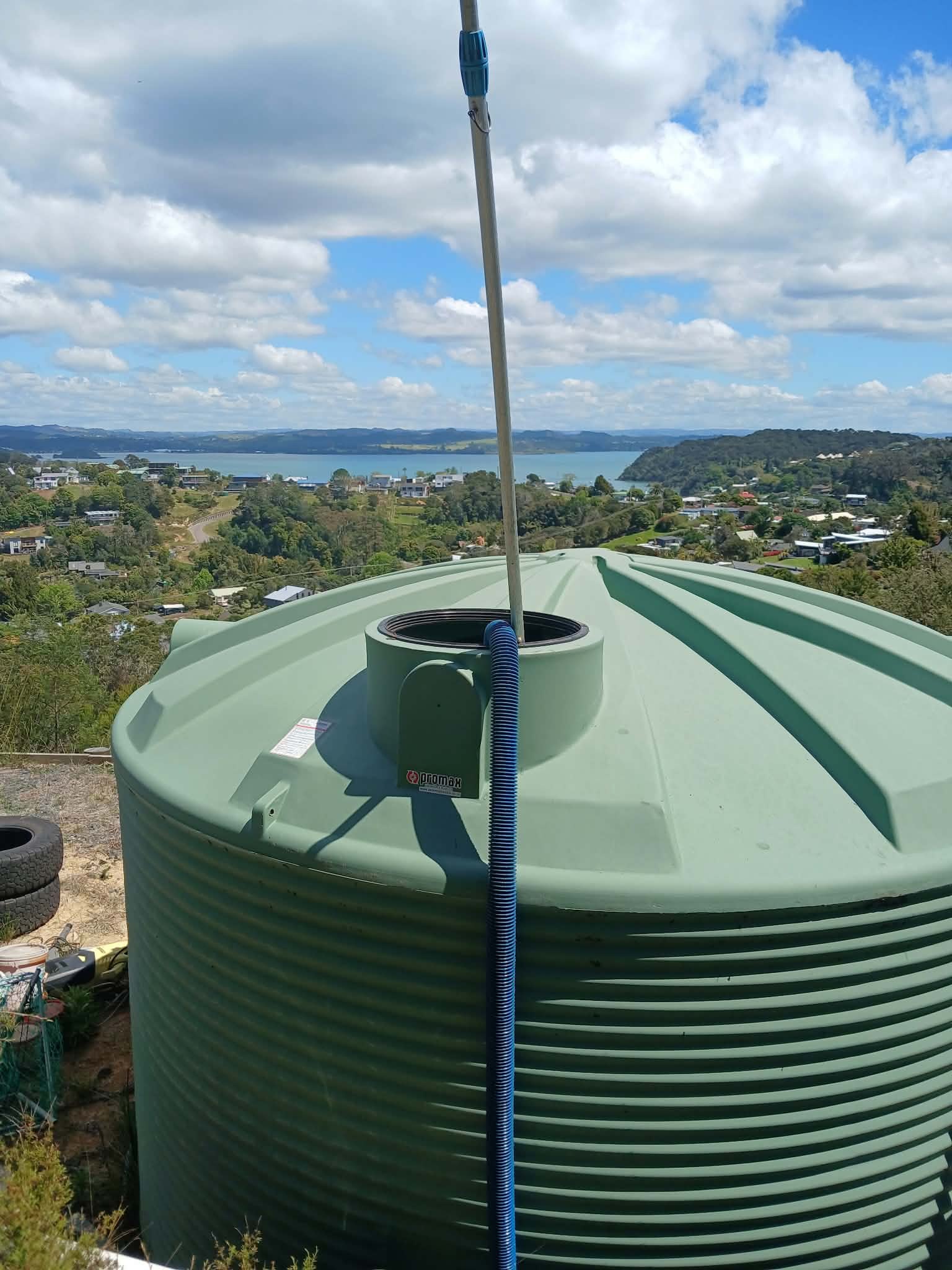 North Tanks cleaning a water tank at a Northland property with coastal views